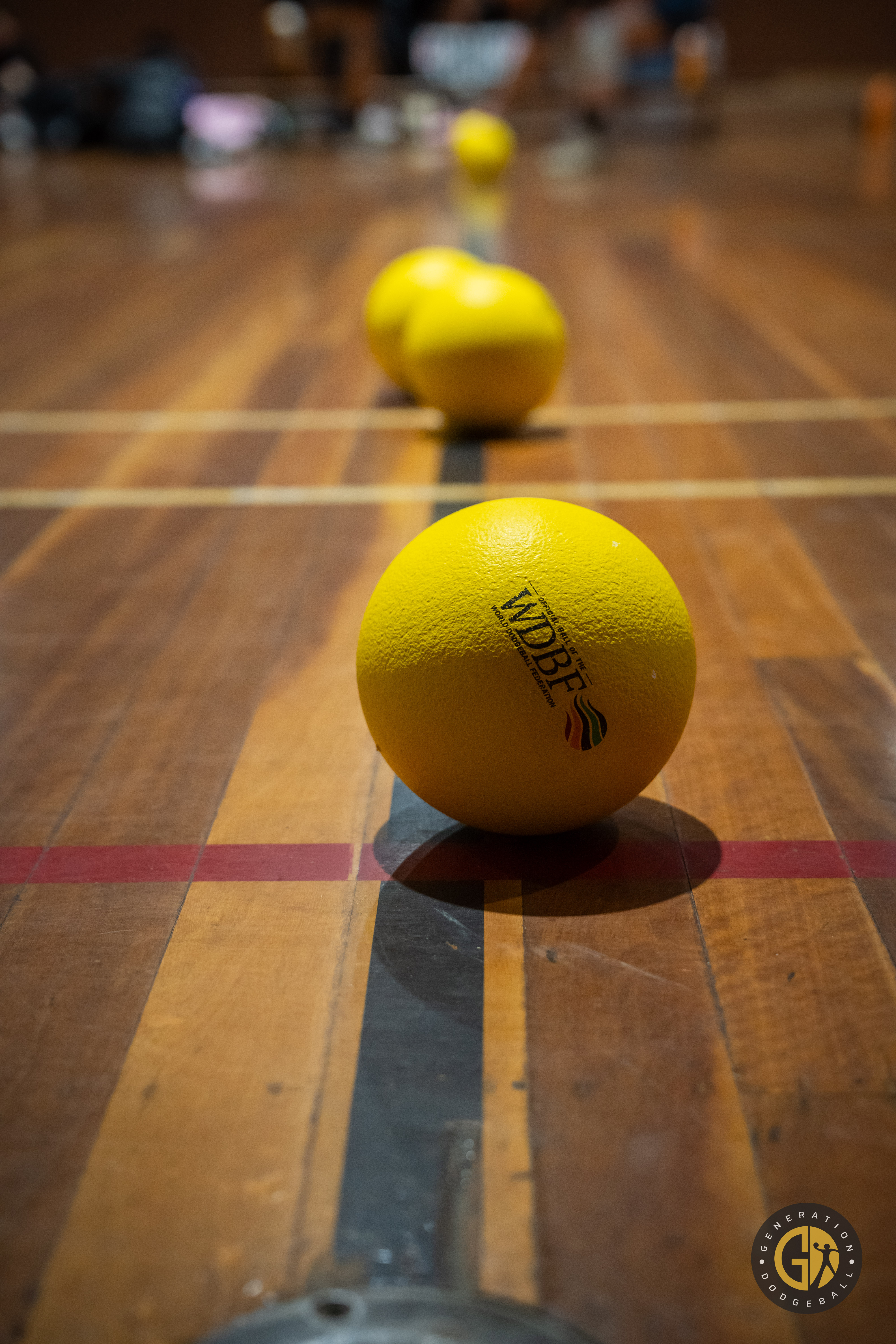 Intense dodgeball match showing players in action, demonstrating agility and teamwork