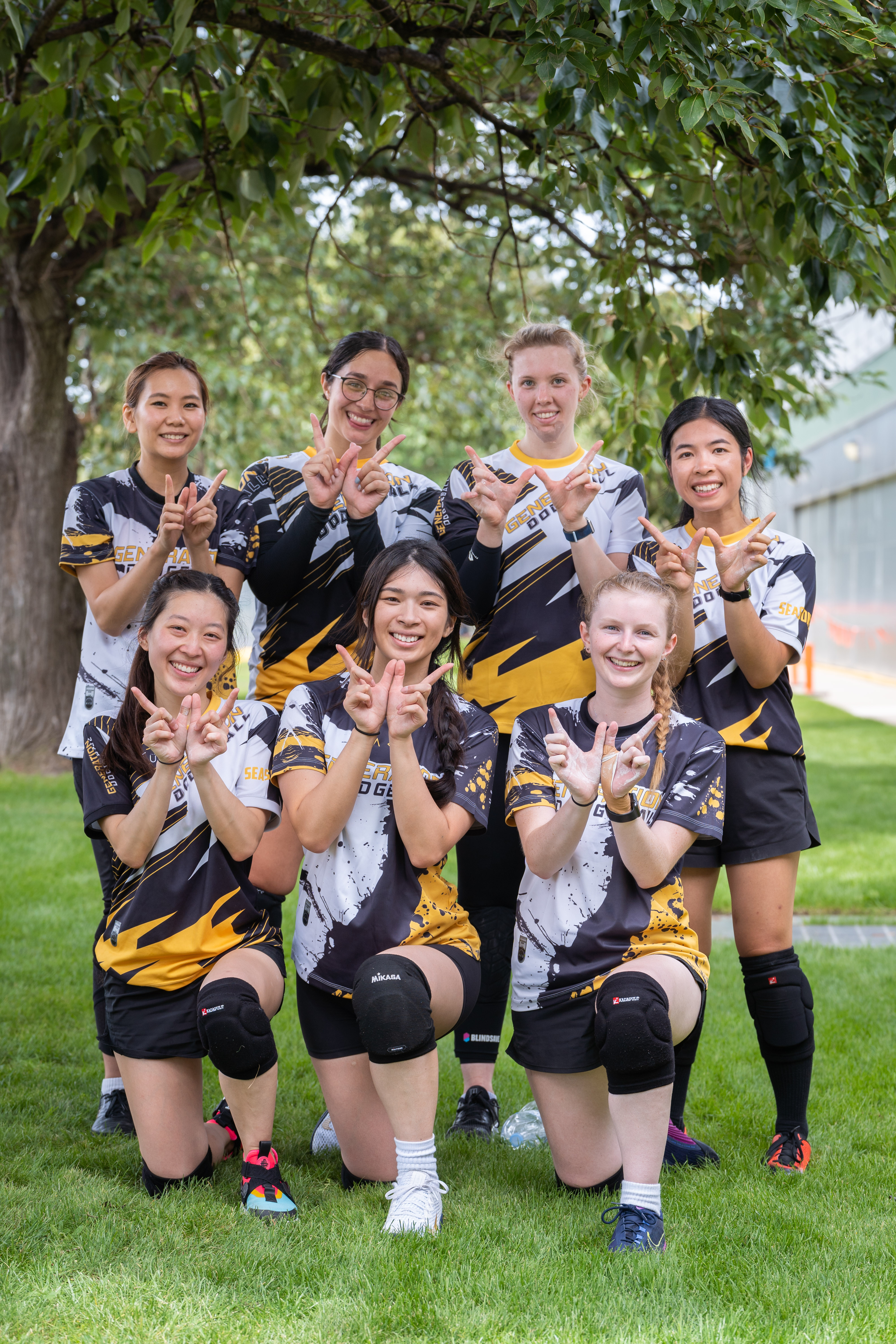 Happy dodgeball team celebrating after a game